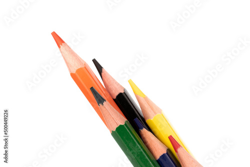 Several colored pencils, macro, isolated on a white background.