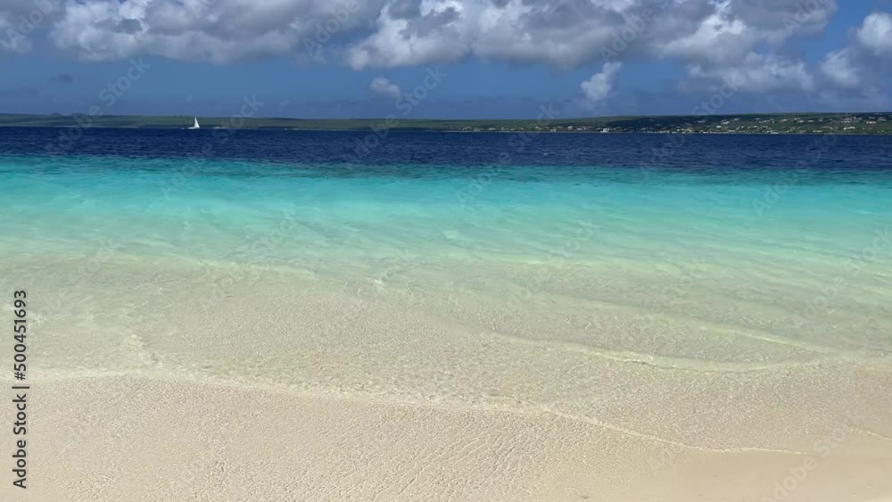 Sandy deserted tropical beach with turquoise sea and blue sky with clouds. Sandy deserted tropical beach with turquoise sea and blue sky with clouds.