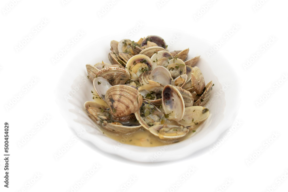 Clams dish with garlic, parsley, olive oil. Served hot. Isolated on white background. Spanish food. Clams dish with garlic, parsley, olive oil. Served hot. Isolated on white background. Spanish food.