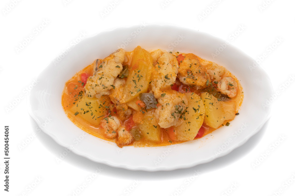 Potato stew with cod, shrimp and parsley on top, served on a white plate. Isolated on white background, Selective focus. Spanish food. Potato stew with cod, shrimp and parsley on top, served on a white plate. Isolated on white background, Selective focus. Spanish food.