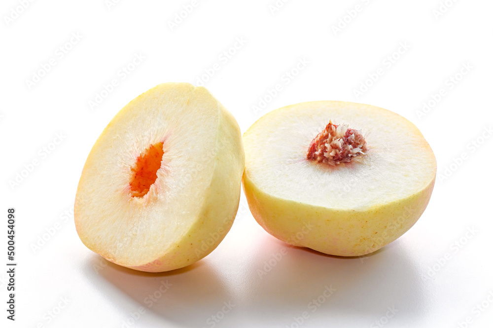 close-up white peach cut half on white background