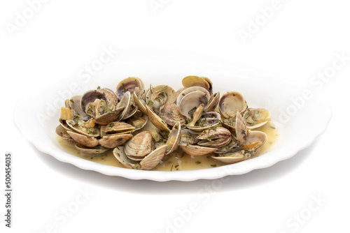 Clams dish with garlic, parsley, olive oil. Served hot. Isolated on white background. Spanish food.