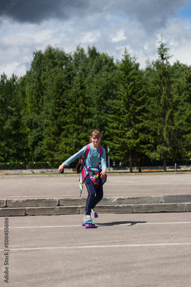 Obraz premium Beautiful girl skateboard energy skateboard dynamic city outdoor.