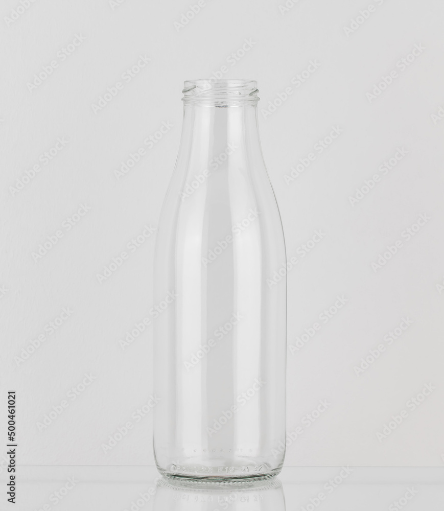 Empty glass bottle without cap. Bottle for milk and water isolated on white background. Empty glass bottle without cap. Bottle for milk and water isolated on white background.