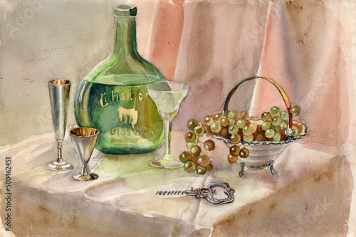 Watercolor still life painting, a bottle of green transparent glass with brandy, cupronickel gilding cognac glasses, a silver metal corkscrew, an engraved crystal wine glass, vase with green grapes photo