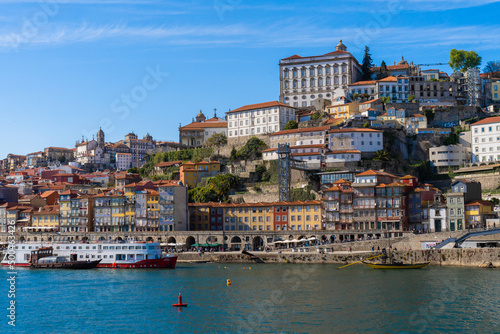 Cityscape of the city of Porto, Douro river with its old boat and its typical colored houses on the water's edge. Portugal. Europe. © BooFamily