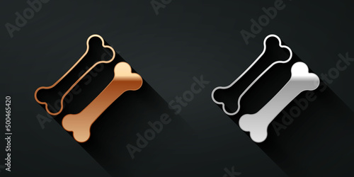 Gold and silver Dog bone icon isolated on black background. Pets food symbol. Long shadow style. Vector