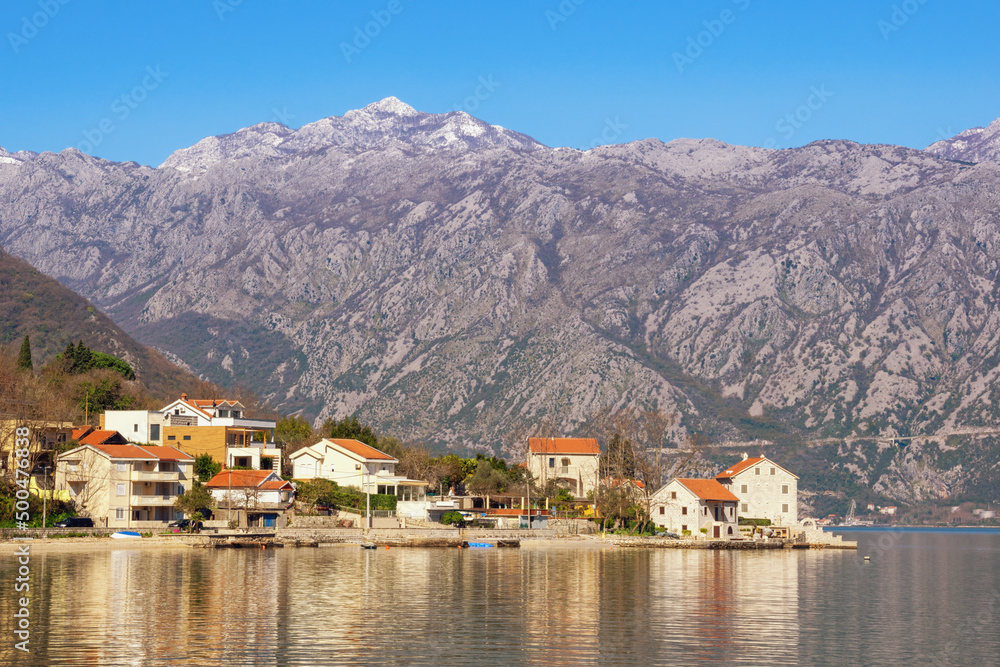 Beautiful Mediterranean landscape  on sunny spring day. Montenegro, Adriatic Sea. View of Kotor Bay and seaside village of Stoliv