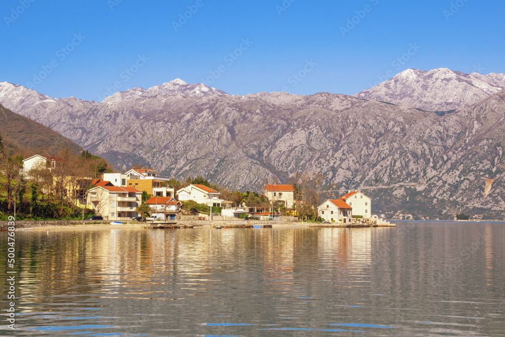 Fototapeta premium Beautiful Mediterranean landscape. Montenegro, Adriatic Sea. View of Bay of Kotor and Stoliv village on sunny spring day