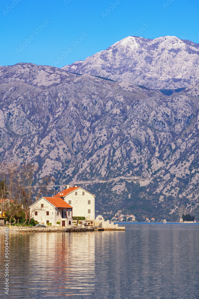 Beautiful Mediterranean landscape. Montenegro, Adriatic Sea. Kotor Bay, village of Stoliv and snow-capped mountains