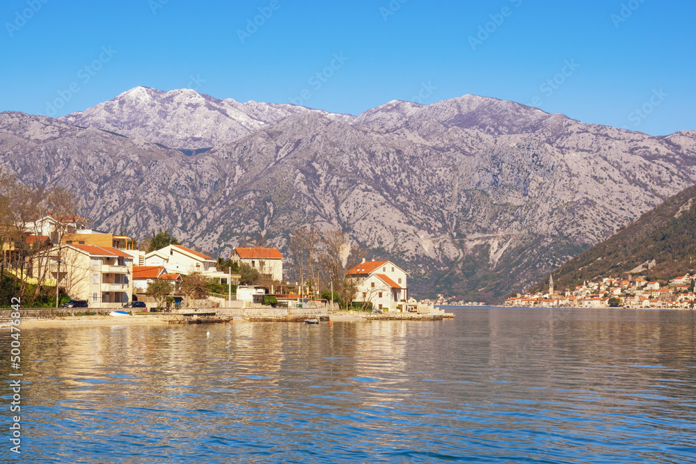 Beautiful Mediterranean landscape  on sunny spring day. Montenegro, Adriatic Sea. View of Kotor Bay and Stoliv village. Perast town in distance