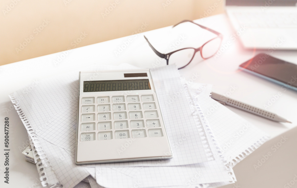 business background with laptop, notepad, calculator on white background. accounting concept business background with laptop, notepad, calculator on white background. accounting concept