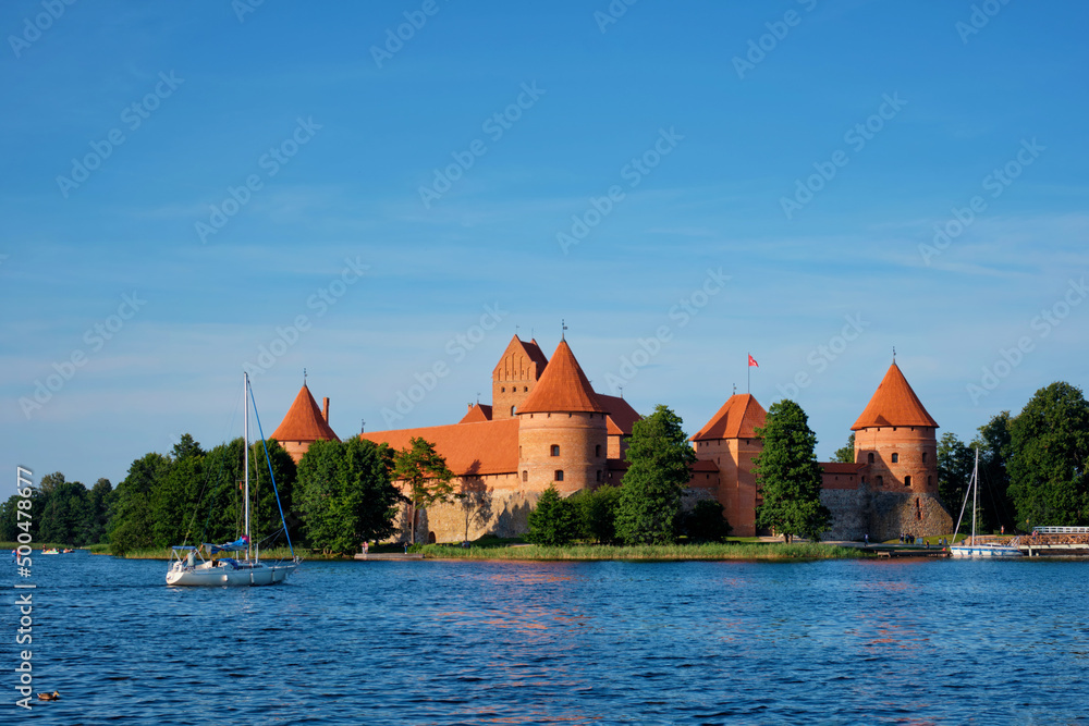 Trakai Island Castle in lake Galve with boats in summer day, Lithuania. Trakai Castle is one of major tourist attractions of Lituania