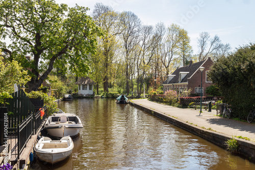 Pleasure boats along the Angstel River in the picturesque village of Abcoude. photo