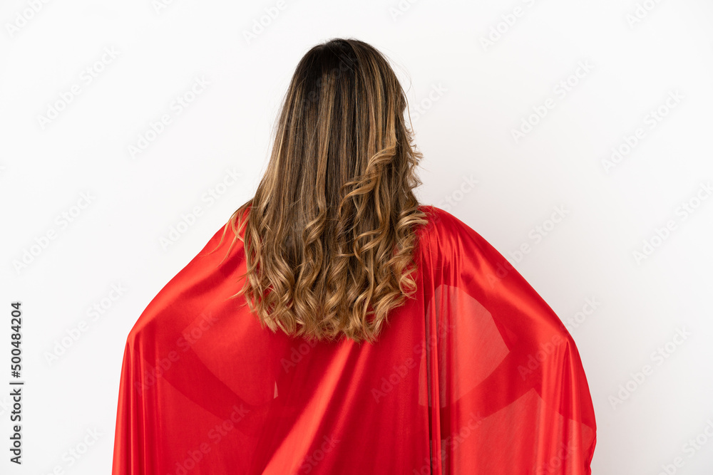 Super Hero woman over isolated white background in back position Super Hero woman over isolated white background in back position