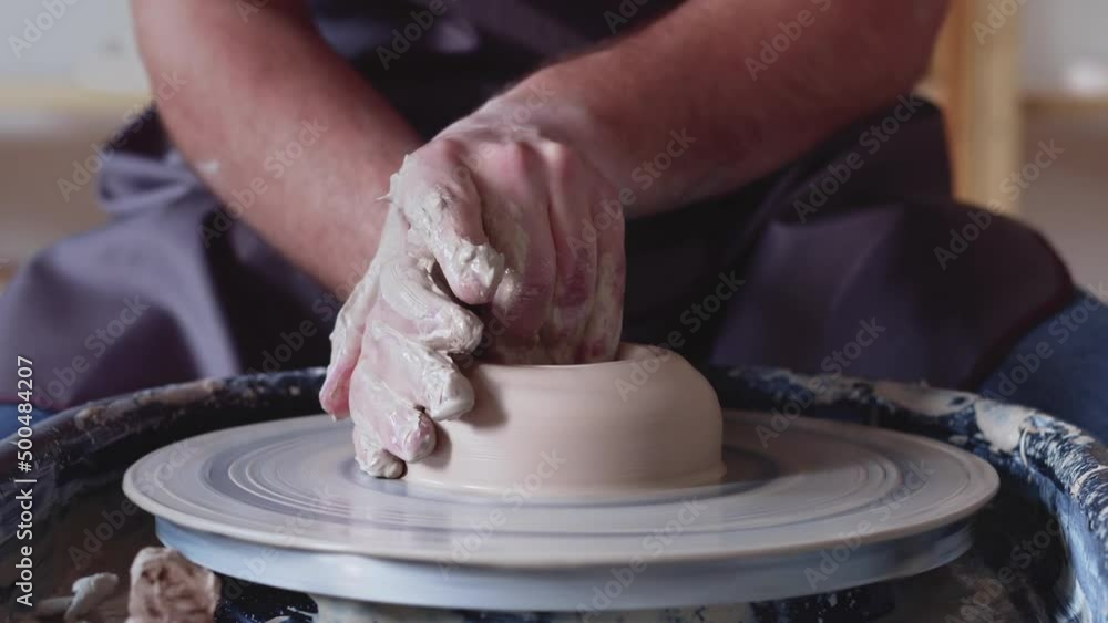 Hand work on pottery wheel, shaping a clay pot, student make of clay pot at studio Hand work on pottery wheel, shaping a clay pot, student make of clay pot at studio