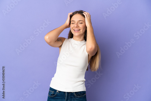 Young Lithuanian woman isolated on purple background laughing © luismolinero