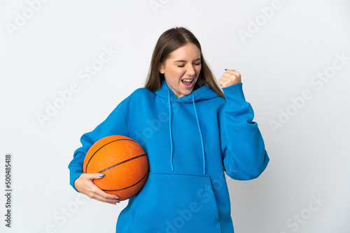 Young Lithuanian woman isolated on white background playing basketball © luismolinero