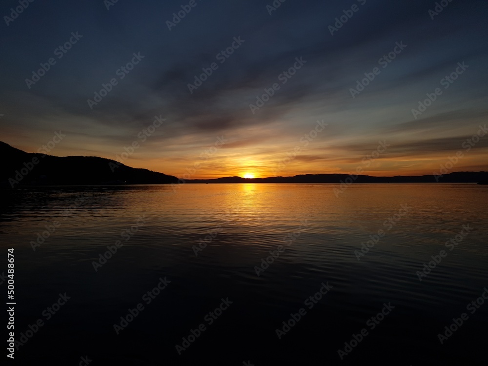 sunset over the mountains and water - Trondheim