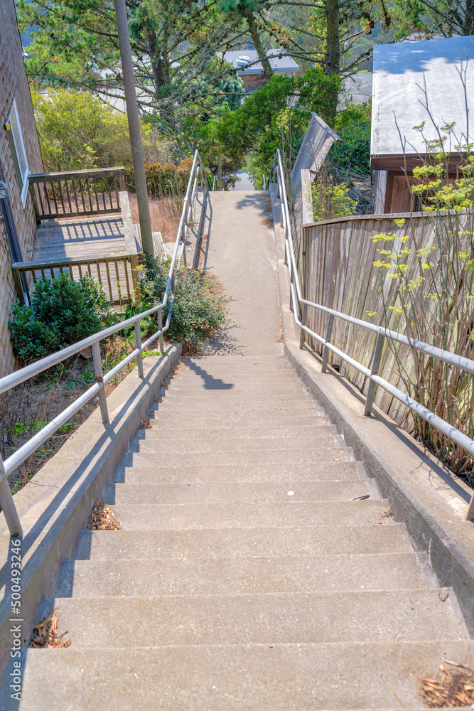Concrete stairs with metal handrail and landing at San Francisco, California Concrete stairs with metal handrail and landing at San Francisco, California