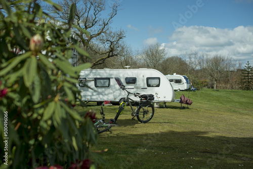 White caravan  trailer on a camp site  in the English Countryside.