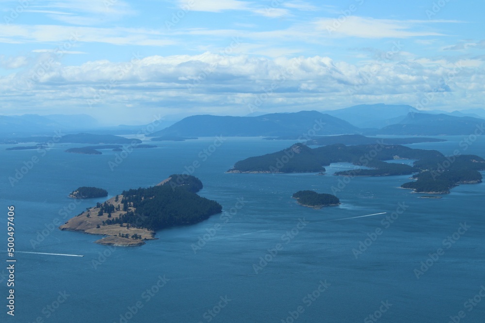 san juan islands, WA with mountains in the distance