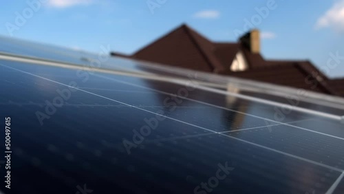 Solar panels on a green energy farm. Power generators produce electricity using solar panels with sunlight. Installing solar panels can provide the cottage with free electricity. Solar panels at home.