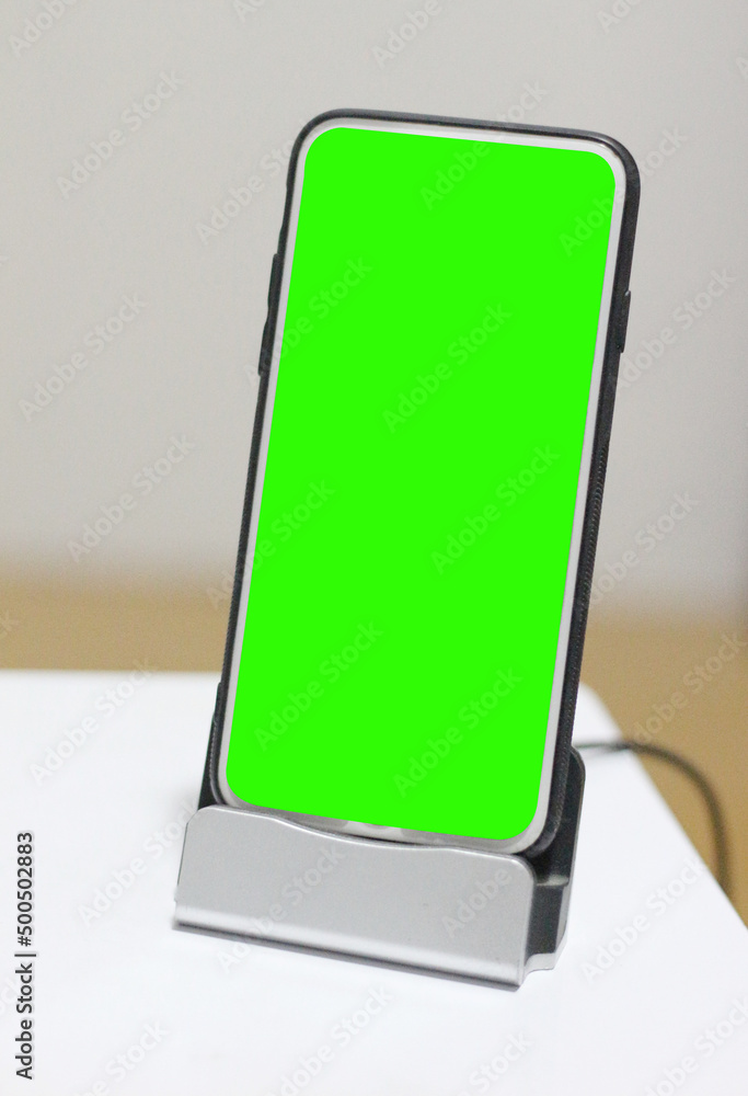 blank green screen mobile phone on table blank green screen mobile phone on table