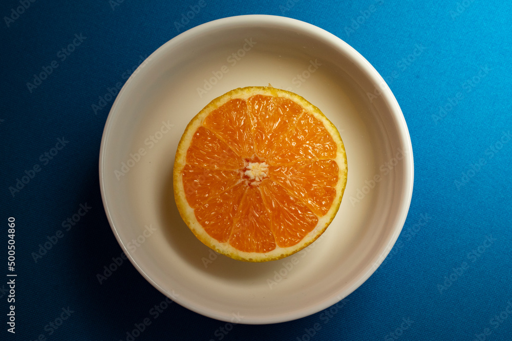 orange on a plate orange on a plate