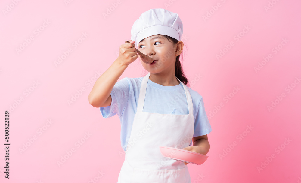 Image of Asian child practicing to be a chef Image of Asian child practicing to be a chef