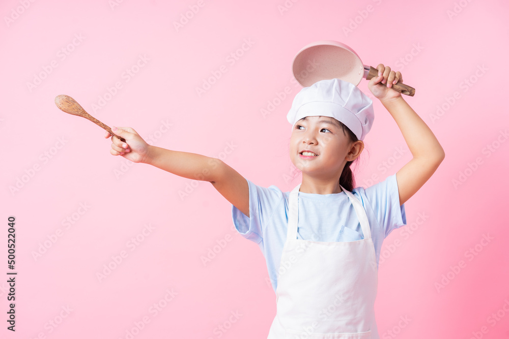 Image of Asian child practicing to be a chef Image of Asian child practicing to be a chef