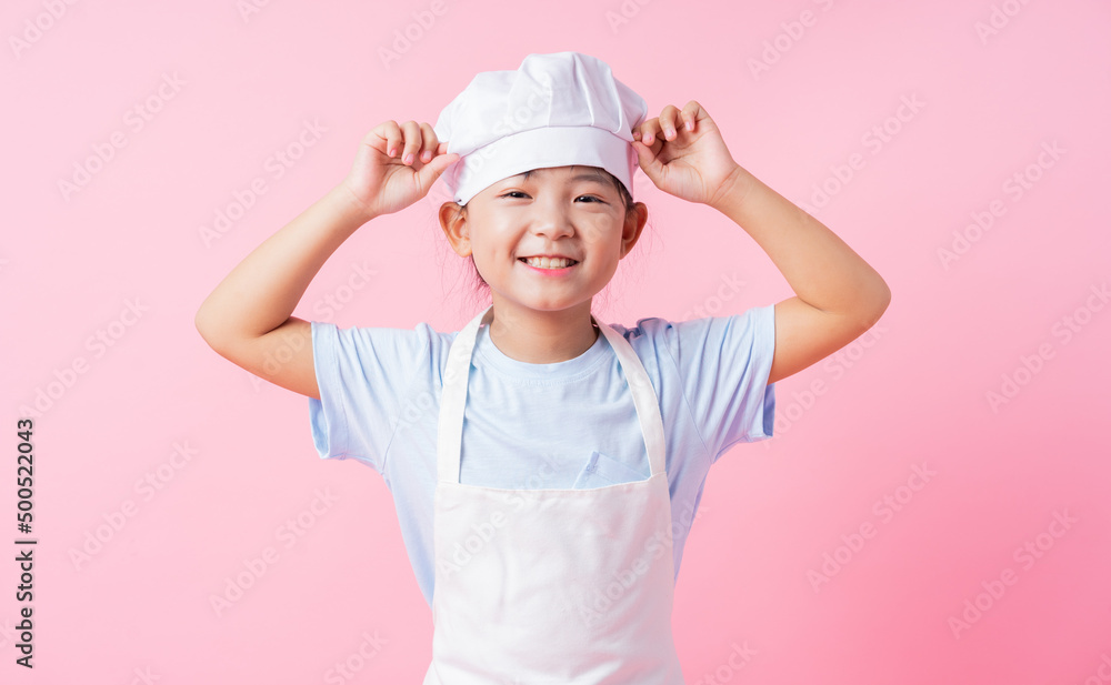Image of Asian child practicing to be a chef Image of Asian child practicing to be a chef