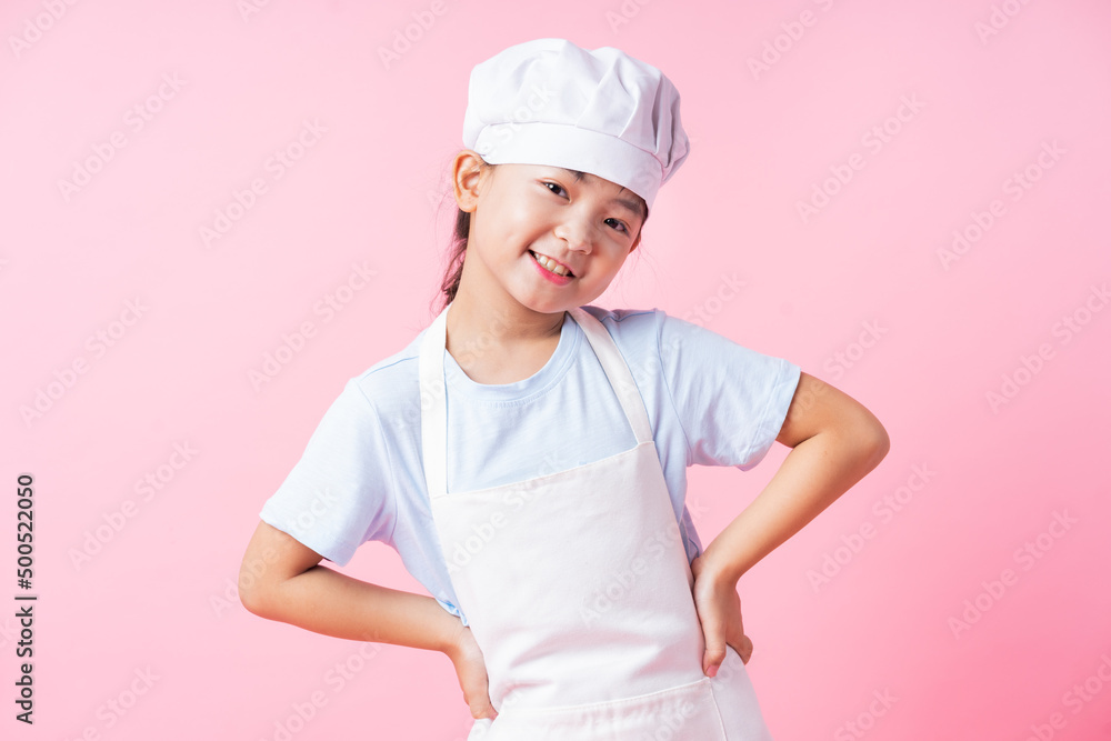 Image of Asian child practicing to be a chef