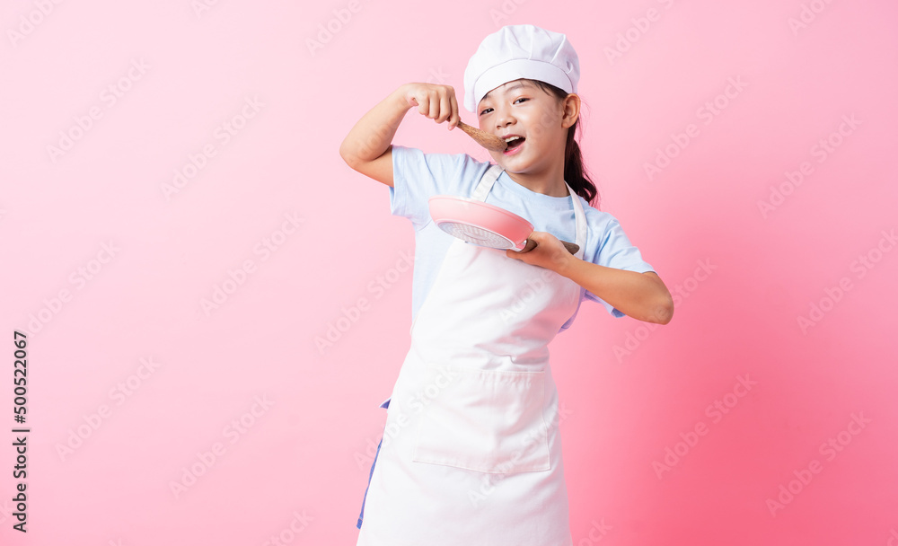 Image of Asian child practicing to be a chef Image of Asian child practicing to be a chef