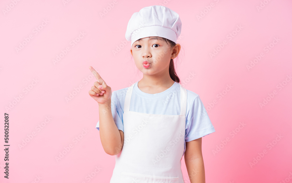 Image of Asian child practicing to be a chef Image of Asian child practicing to be a chef