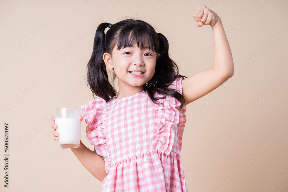 Image of Asian child drinking milk on background Image of Asian child drinking milk on background