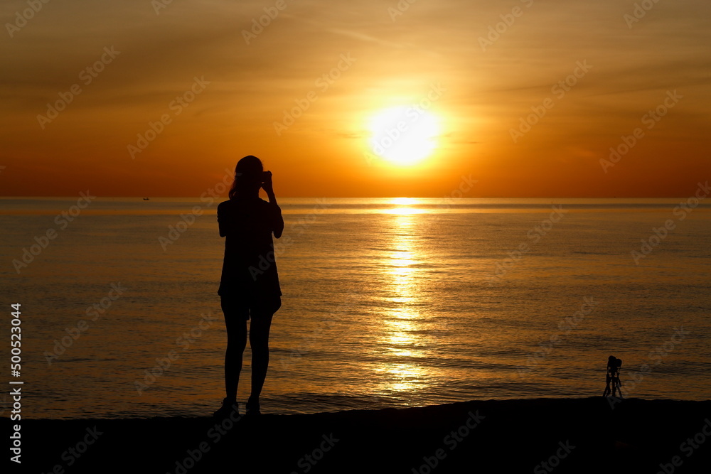 woman silhouette enjoy the sunrise