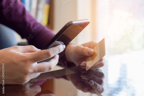 woman online payment by credit card and using smartphone 