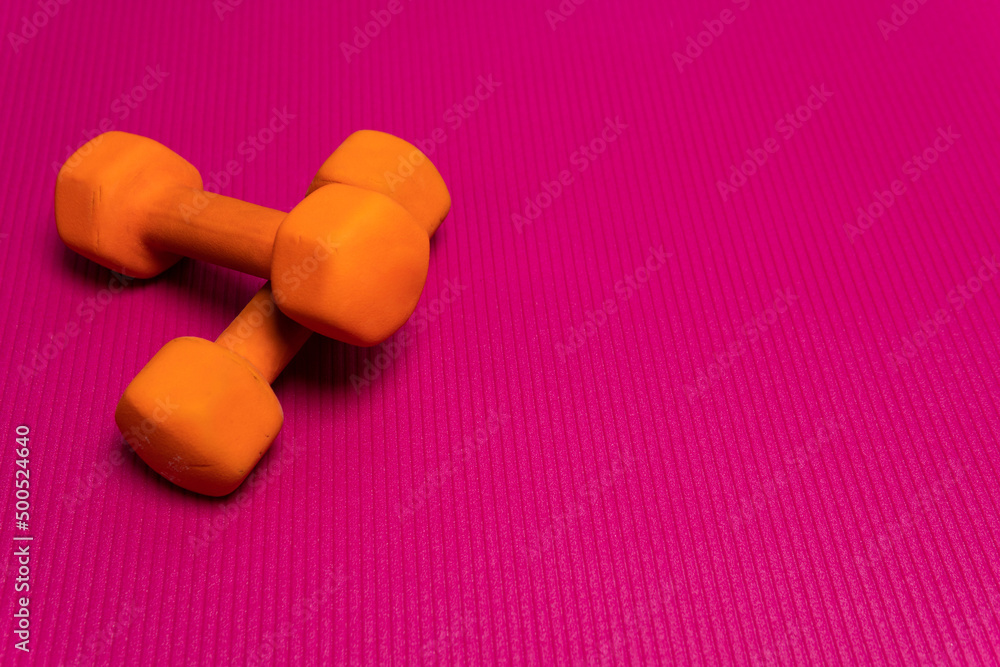 Space fitness orange dumbbell mat gym background purple white, from wellness fit for wood from active banner, girl isolated. Health home, Space fitness orange dumbbell mat gym background purple white, from wellness fit for wood from active banner, girl isolated. Health home,