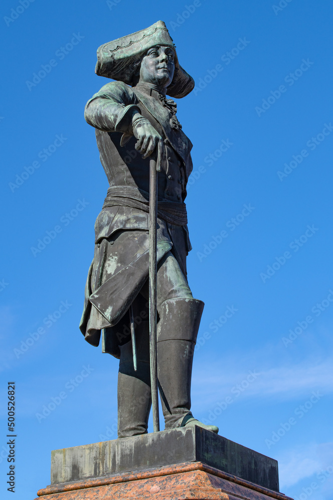 Ancient sculpture of the Russian Emperor Paul I (installed in 1851) close-up against the blue sky. Monument at the Gatchina Palace. Gatchina, Russia