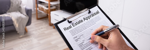 Man Filling Real Estate Appraisal Form