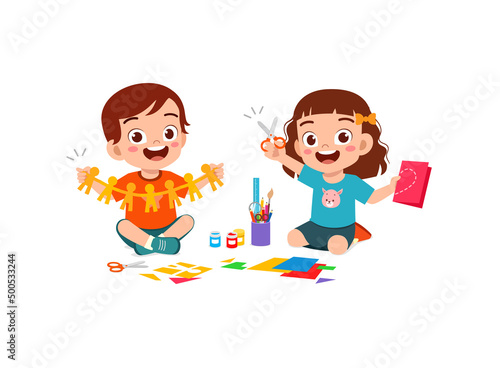 little kid cut paper for art with friend