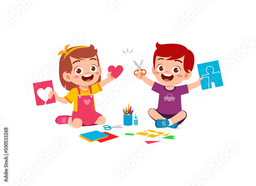 little kid cut paper for art with friend