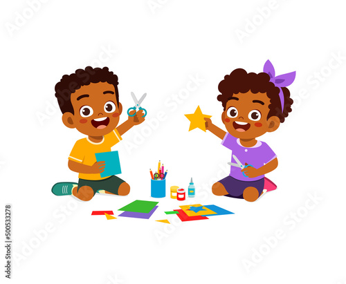 little kid cut paper for art with friend