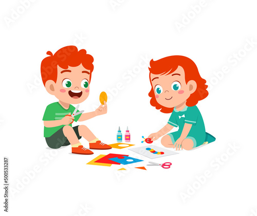 little kid cut paper for art with friend