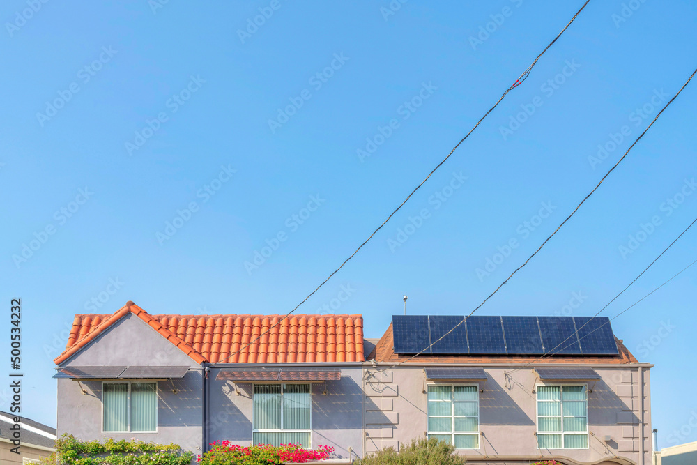 Top part exterior of duplex house with solar panels in San Francisco, California Top part exterior of duplex house with solar panels in San Francisco, California
