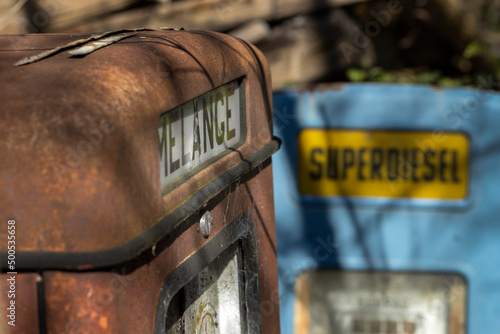 Historical gaspump .At the junkyard.  Abandoned and rusted machinery. Diesel. photo