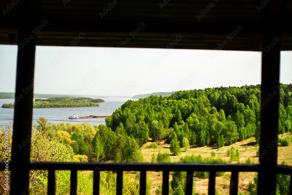 Fototapeta premium Picturesque view from the terrace to the forest and the river. summer season