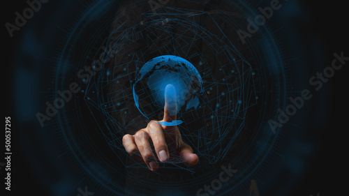 The businessman touches the projection of the planet. Concept of globality of customer network structure, data exchange connections, digital marketing, communication network and internet business. photo