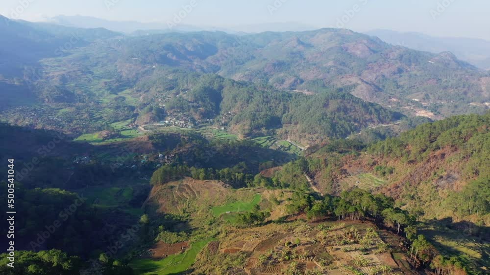The city of Banaue in the rice fields surrounded by the green mountains , Asia, Philippines, Ifugao, Luzon, in summer on a sunny day. The city of Banaue in the rice fields surrounded by the green mountains , Asia, Philippines, Ifugao, Luzon, in summer on a sunny day.